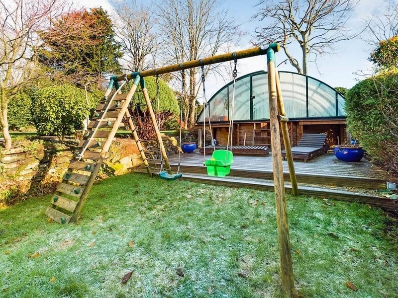Outside there is a large covered heated pool