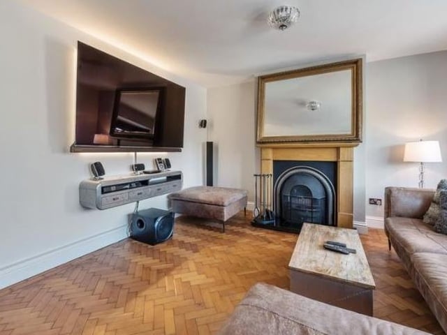 The hallway leads into one of the spacious reception rooms