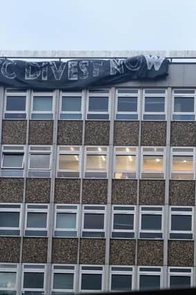 Members of the Divest East Sussex hung the huge sign which read ‘ESCC: Divest Now' on Friday, November 11.