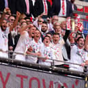 LONDON, ENGLAND - MAY 19: Dion Conroy of Crawley Town lifts the Sky Bet League Two Play-Off Final trophy after the team's victory in the Sky Bet League Two Play-Off Final match between Crawley Town and Crewe Alexandra at Wembley Stadium on May 19, 2024 in London, England. (Photo by Paul Harding/Getty Images)