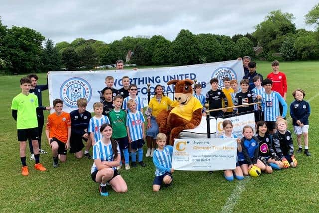 Worthing United Youth FC in training up for their Charity Bedpost in aid of Chestnut Tree House on July 2 & 3. Squad members aged from six to 16 are pictured here with Sidney Squirrel and Caroline Roberts-Quigley from Chestnut Tree House.
