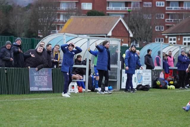 Eastbourne Town management trioJude Macdonald, Ben Davies, and Matt Elphick are up in arms appealing for handball against Crawley Down Gatwick’s goalkeeper outside of his box | Picture by Josh Claxton