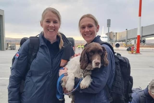 Lindsay holding Davey at Airport along with vet Victoria Phillips