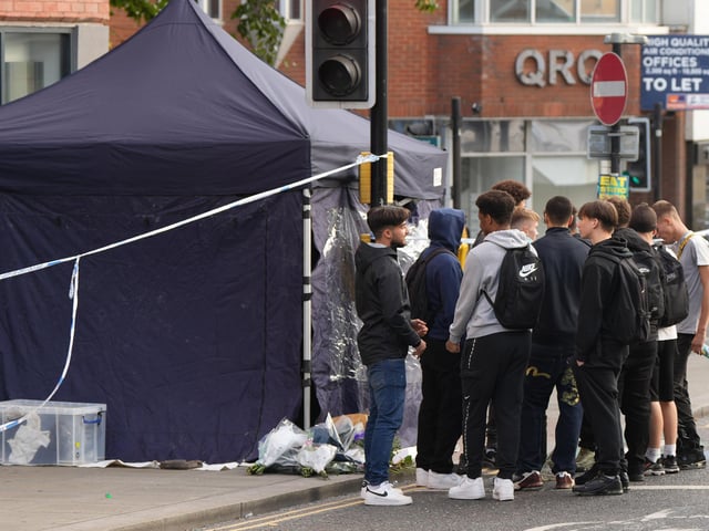 Friends gather at the scene