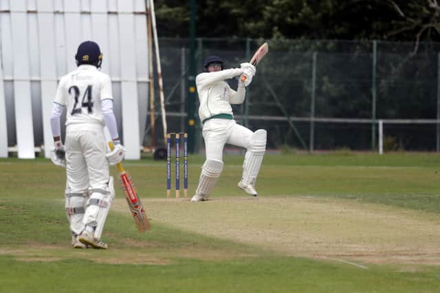 Three Bridges batsman Connor Golding hits out against Horsham on Saturday. Bridges held on for the draw in the Sussex Cricket League Premier Division game. Picture: John Lines