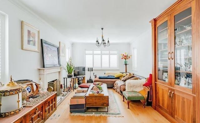 There is a large living room with plenty of space for sofas and chairs to relax in.