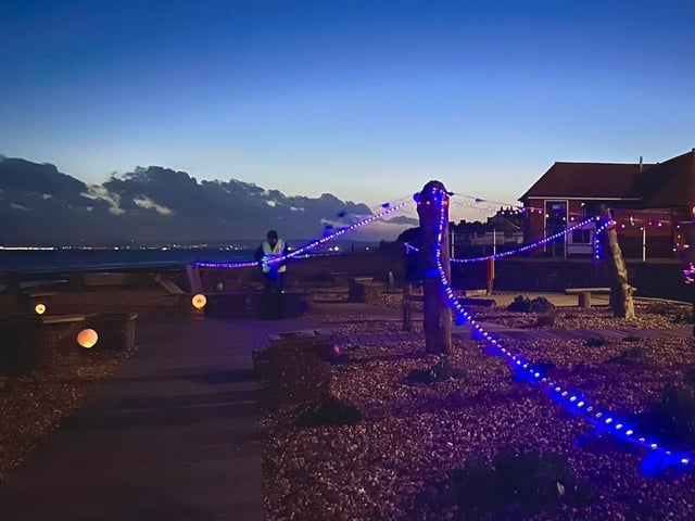 Bexhill Beach Garden illuminated purple for World Polio Day