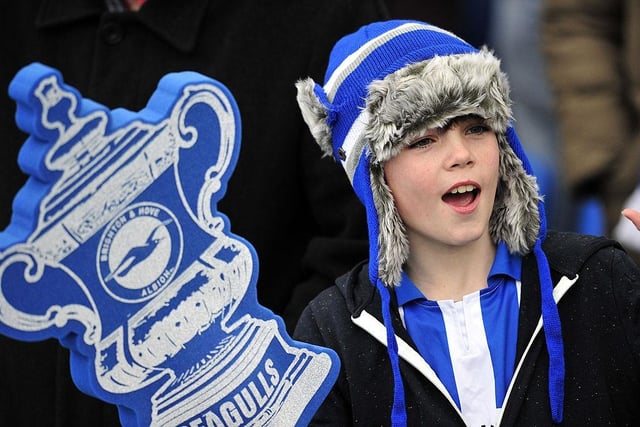 A young Brighton & Hove Albion fan attends the English FA Cup fourth round match between Brighton & Hove Albion and Arsenal at The American Express Community Stadium on January 26, 2013.