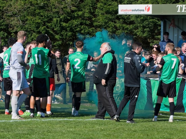 Burgess Hill Town players, fans and staff celebrate surviving in the Isthmian south east division at the end of their 0-0 draw with Beckenham