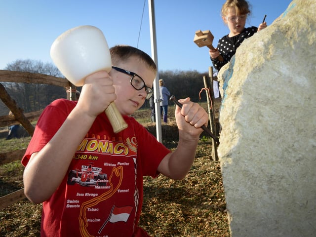 David Porter and Madison Porter chisel and sculpt the Portland stone that became a sculpture