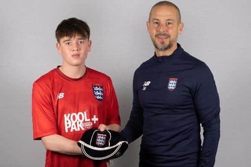 Ossie O'Neill gets his England cap from Colleges coach Darin Killpartrick