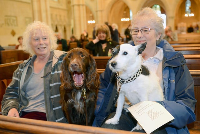 Brita Latham and Rufus, left, with Mary Rivett and Lily at the animal blessing service