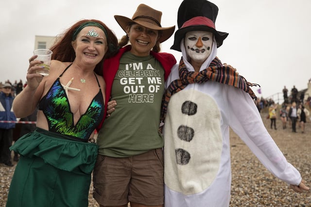 Three people in their costumes who took part in East Wittering with the 1st Birdham & Wittering Scout Group New Years Day 'Big Dip' 2023 raising money for scouts beavers young people's activities.