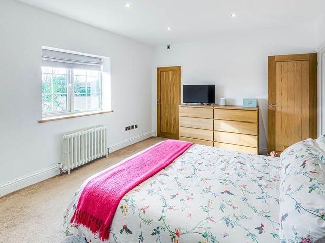 This stunning flint-and-brick detached house dates to the 1800s and used to be a pub. It was converted in about 2016 and boasts four bedrooms, three reception rooms and mature, secluded gardens.