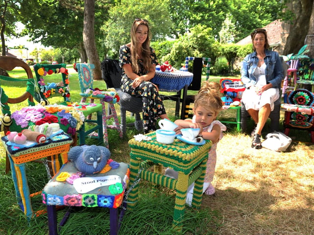 East Preston Yarnbombers have created an enchanting picnic area with chairs that are beautifully-decorated knitted masterpieces