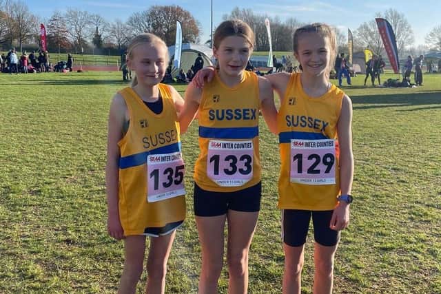 Kitty Morgan, Megan Hopkins-Parry and Isabella Buchanan of HY Runners in Sussex action