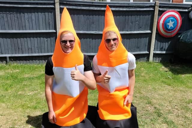 Tobey Herr and friend Ryan Richardson-Green are taking part in a sponsored walk dressed as traffic cones to fund a charity trip to Romania