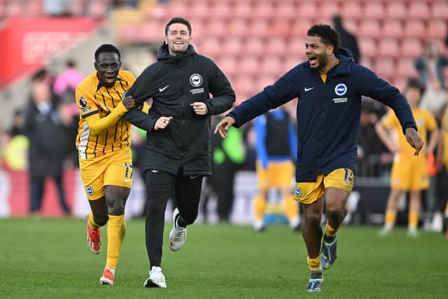 Fabian Hurzeler initially watched on as his players celebrated the victory in front of the away fans – before he was convinced by Georginio Rutter and Yankuba Minteh to join in.(Photo by Mike Hewitt/Getty Images)
