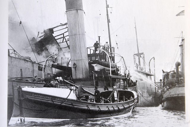 Eastbourne's lifeboat, the Jane Holland, alongside the SS Barnhall - bombed on March 20, 1940. 29 crew were rescued.