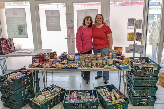 Staff from the Burgess Hill Community Foodbank and Burgess Hill Pantry accept donations