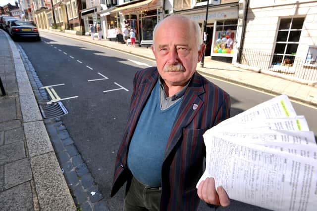 Stephen Catlin with a parking petition (Peter Cripps/Sussex World)