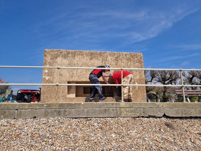 Pete Coe, one of the project leaders, and fellow former Royal Engineer Graham Cosham worked together to open the southern embrasure at the Ferring pillbox
