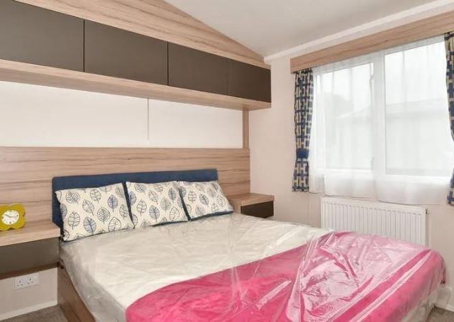 The property has two bedrooms, one of which has an ensuite shower room