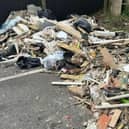 The fly-tipping rubbish that has been left in the car park of the school for weeks.