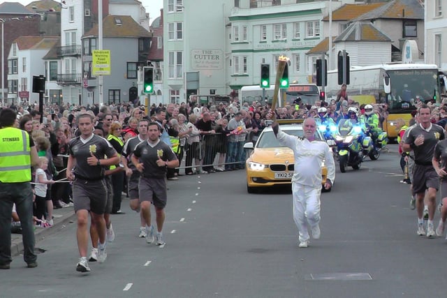 Keith Leech with the Olympic Torch in Hastings