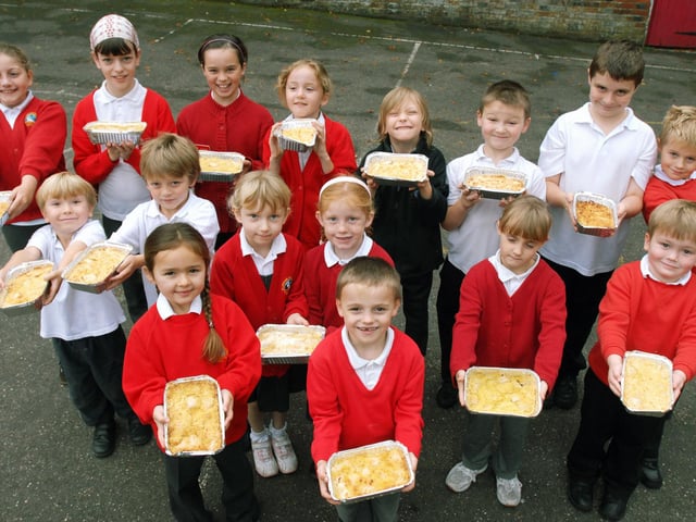 Pupils with the apple crumbles they made for villagers in 2007 using ingredients donated by Sussex Farmhouse Meals