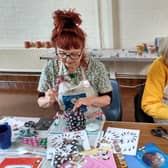 A group of over 55s in St Leonards try decoupage for the first time