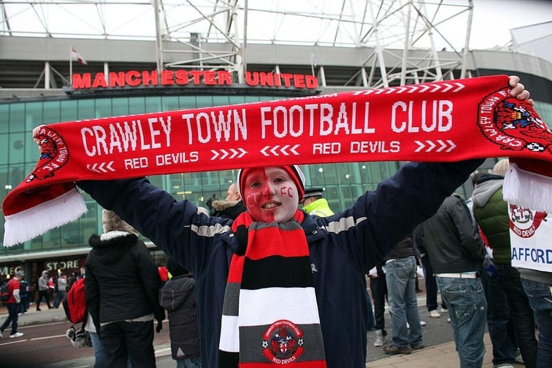 Crawley Town fan Reece Bateman, aged 10,  enjoys the atmosphere outside Old Trafford.