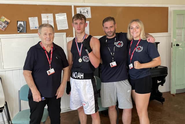 Noah Jolly with coaches John and Danny Essex and Libby Baker  | Picture by Horsham Boxing Club