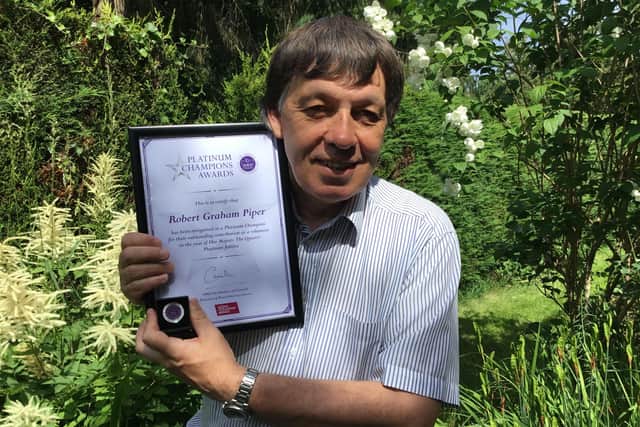 Robert Piper with his Platinum Champion award