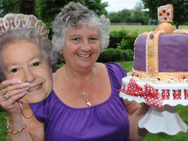 Diamond Jubilee party at Suzanne Green Day Centre. Janette Johnson, as the Queen, with a special birthday cake made by Nikki Jarvis