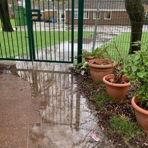 A group of residents are involved in a row with a Worthing primary school after instances of heavy flooding, which they say is destroying their gardens.