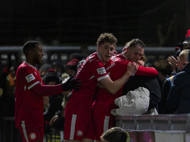 Teddy Jenks (24 Worthing FC) celebrates with a fan during the match between Worthing FC and Dorking Wanderers in the Enterprise National League South at Sussex Transport Community Stadium : Worthing v Dorking Wanderers, National League South