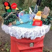 The post box topper in Pulborough marks the anniversary of road chaos in the village. The A29 at Church Hill was shut on December 28 2022 following a landslide. Traffic is currently controlled by lights and road repairs are still awaited.