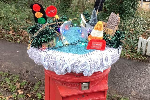 The post box topper in Pulborough marks the anniversary of road chaos in the village. The A29 at Church Hill was shut on December 28 2022 following a landslide. Traffic is currently controlled by lights and road repairs are still awaited.