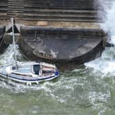 A small sailing boat has sunk in a Sussex marina after striking a harbour wall.