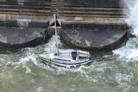 A small sailing boat has sunk in a Sussex marina after striking a harbour wall.