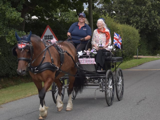 Centenarian Sheila Reynolds enjoying a surprise ride in a horse and carriage to mark her 100th birthday