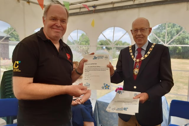Arundel mayor Tony Hunt presents Arundel postmaster Paul Money with the Dementia Friendly 2022 certificate for Arundel Post Office