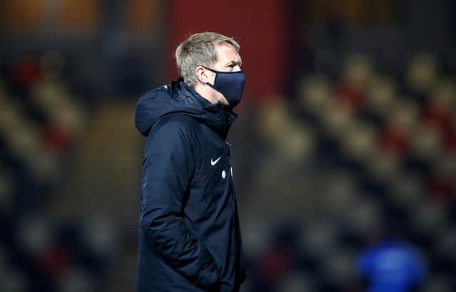 Brighton boss Graham Potter is seen inspecting the pitch prior to the FA Cup third round match against Newport County at Rodney Parade.