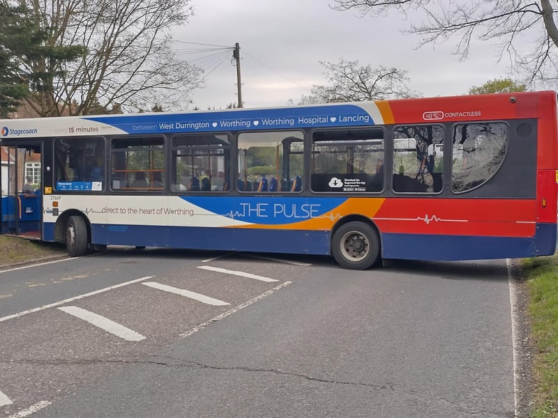 Photos taken at the scene show a bus has become stuck, when trying to turn around to avoid the road closure.