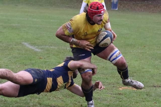 Worthing Raiders' Frank Taggart tries to evade a Sevenoaks man | Picture: Colin Coulson