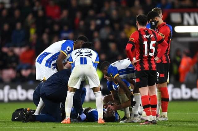 Moises Caicedo of Brighton & Hove Albion receives medical treatment during the Premier League match at AFC Bournemouth