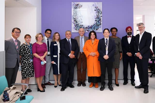 Masoud Teimory, sixth left, and Professor Bernard Chang, fourth right, with Southlands Eye Care consultant ophthalmologists and invited guests