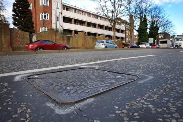 The loose manhole cover in Albion Way, Horsham, that's making life a misery for people living nearby.  Pic S Robards SR2212061
