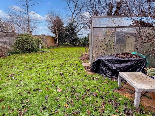 The garden includes a summerhouse, shed and water tap